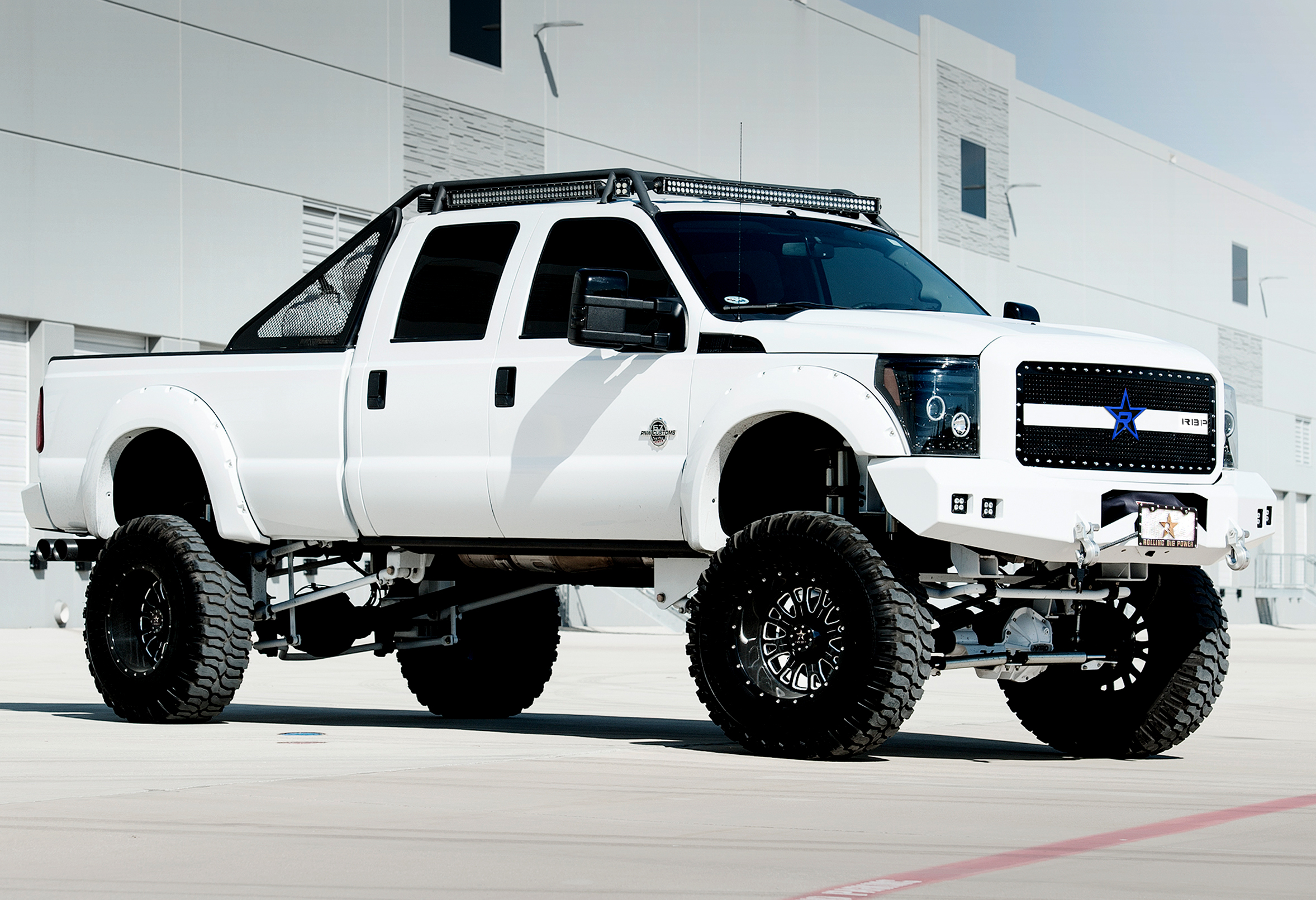 Lifted full size white Ford 4x4